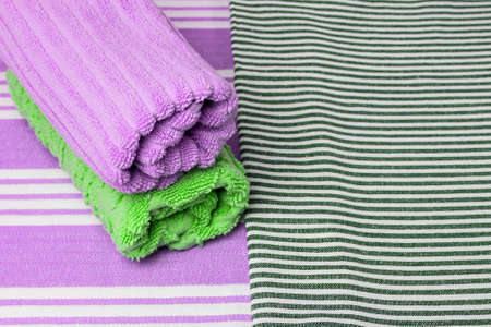 Colored towels on a bright background. Top view.の写真素材