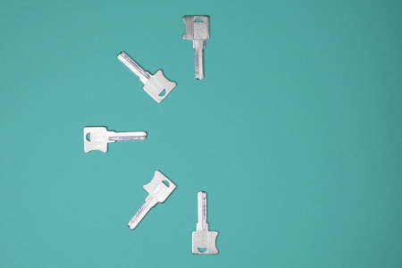 Keys on a colored background, top view. Fashionable colorful photo. Trendy flat lay concept.
