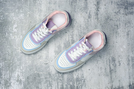 Sports sneakers on a concrete background. Sports shoes. Top view, flat lay.の写真素材