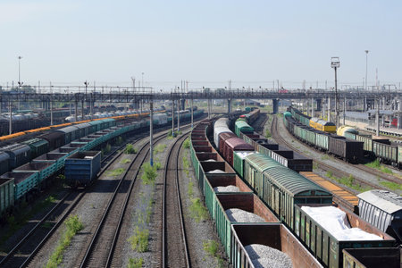 Russia, Chelyabinsk, July 08, 2022: Freight wagons with cargo at the railway station. Major transport railway junction. Sending wagons for export.のeditorial素材