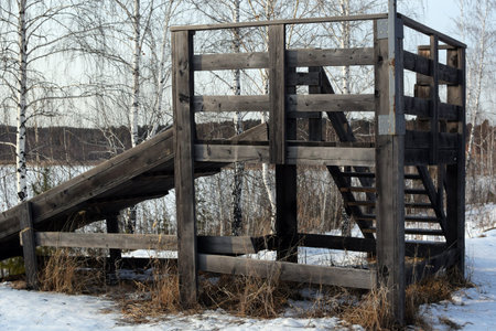An old wooden slide in the countryside. Winter Fun Conceptの写真素材