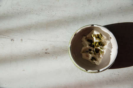 Breakfast for a healthy lifestyle. Delicious ice cream with pumpkin seeds. Perfect loft background...