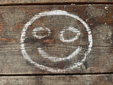 Smiley painted on flour. Home production of baked goodの写真素材