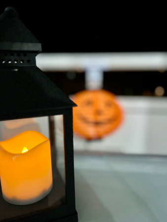 Jack o lantern glowing with moonlight in night forest. Halloween bokeh background with burning orange pumpkin. Happy Halloween banner. Copy space for text. High quality photoの写真素材