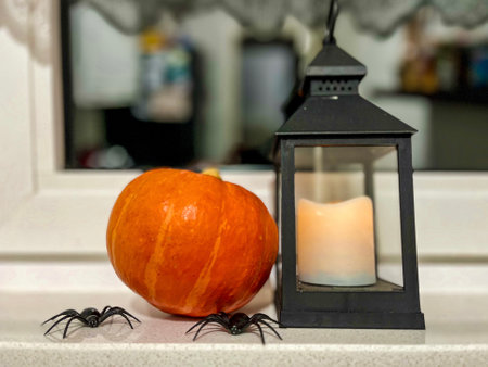 Halloween decoration. Pumpkin lantern and autumn leaf in home interior design. Festive decorated table family traditional celebration. Fall holidays.. High quality photoの写真素材