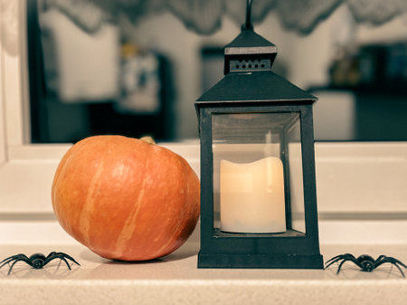Halloween decoration. Pumpkin lantern and autumn leaf in home interior design. Festive decorated table family traditional celebration. Fall holidays.. High quality photoの写真素材
