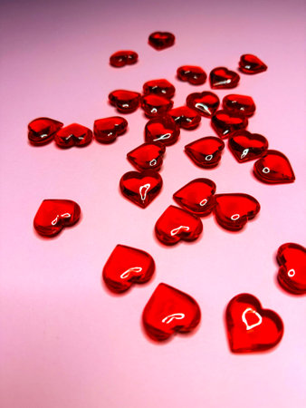 Pink background with glitter hearts for Valentine's Day. Beautiful wrapping paper or background for...