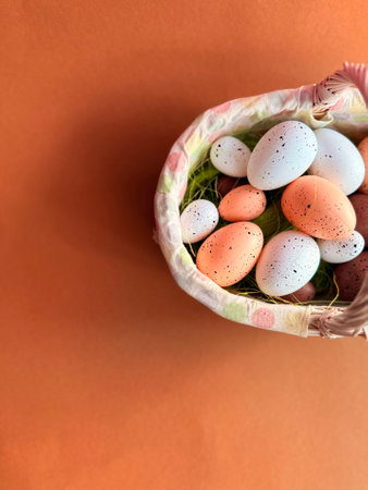 Easter eggs in nest on color wooden background. High quality photo