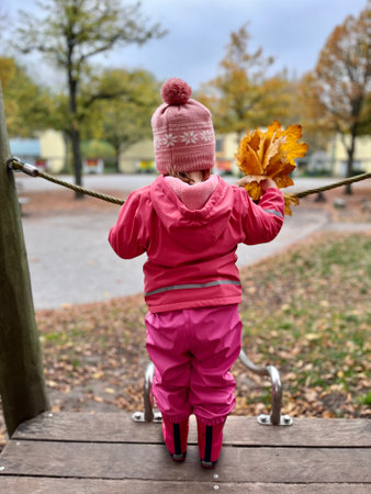 Autumn season leisure. Atmosphere of autumn. Adorable smiling schoolgirl autumn foliage background. Good mood. Happy child. Welcome October.の写真素材