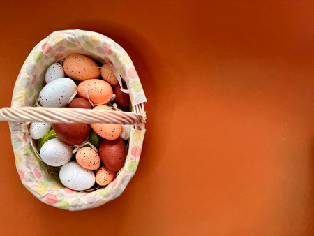 Easter eggs in nest on color wooden background. High quality photoの写真素材