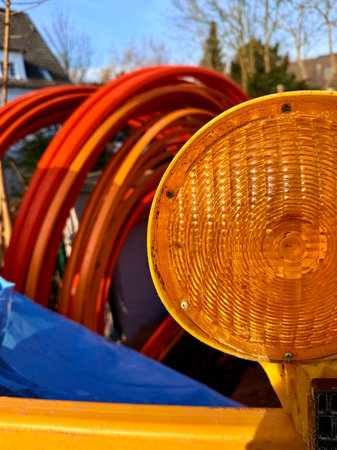 Coiled black PVC hoses with a blue lines. Polyethylene tubing, pipe material at construction site. High quality photoの写真素材