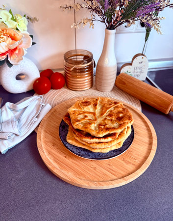 Romanian and Moldovan pies are fried in a large frying pan. Traditional homemade round pies -...