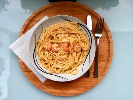 delicious spaghetti with shrimps, tomatoes, basil and cheese - Italian food style.の写真素材