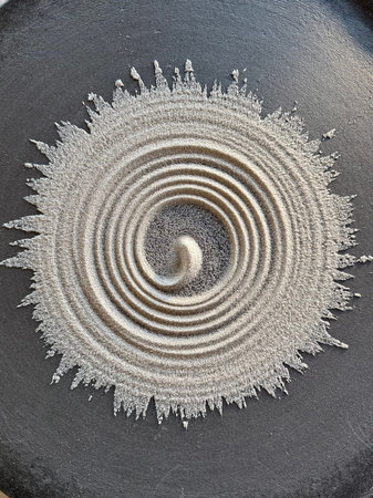 spiral design traced in sand.の写真素材