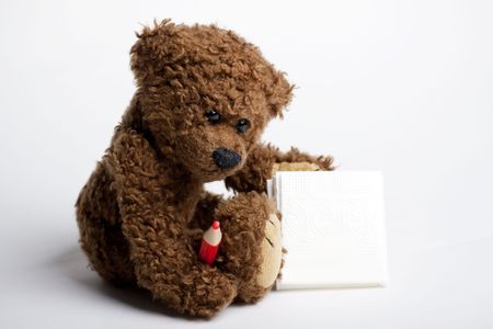 Bear Teddy with a pen and paper for messages.の写真素材