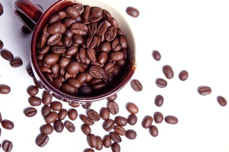 Beans of coffee and chocolate in a coffee cup.の写真素材