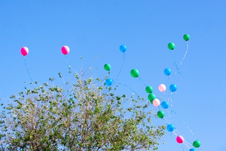balloons departing to the skyの写真素材