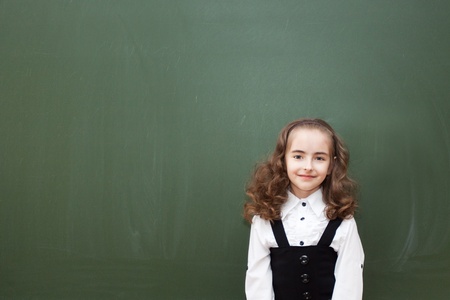 small schoolgirl about a blackboardの写真素材