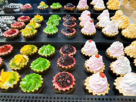 Fruit dessert in the shop window. sale of beautiful, delicious, delicious dessertsの写真素材