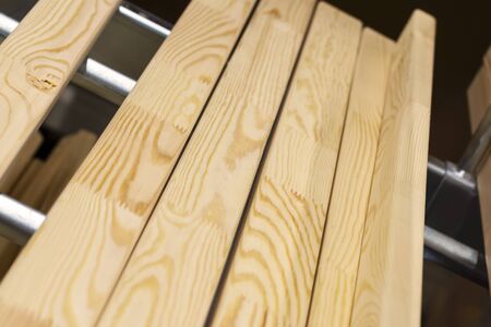 Shelving of wood panels in a hardware store. Building material from wood, timber, boards. Wood...