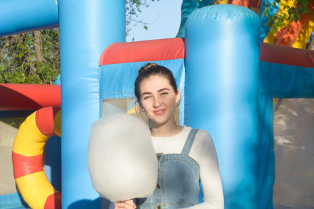 Young beautiful woman stands by the river Happy summer mood.の写真素材