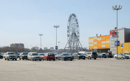 April 10, 2021 Russia. Tula. Parking lot at the Maxi shopping center. A lot of parked cars near the...