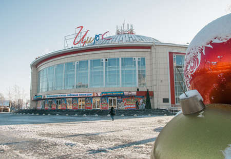 10.12.2021, Russia, Tula. Circus building on a frosty winter sunny morning with a man walking besideのeditorial素材