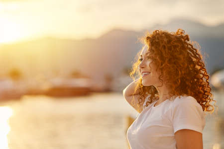 Red head Woman portrait on the beach