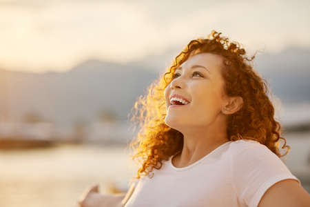 Happy young red head woman
