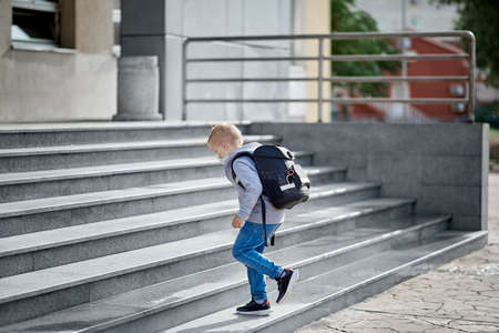 Child with face mask going back to school after covid-19 quarantine and lockdown