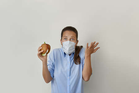 Pretty woman tries to eat a vegan burger
