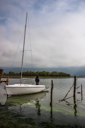 Man in his yacht enjoying the viewの写真素材