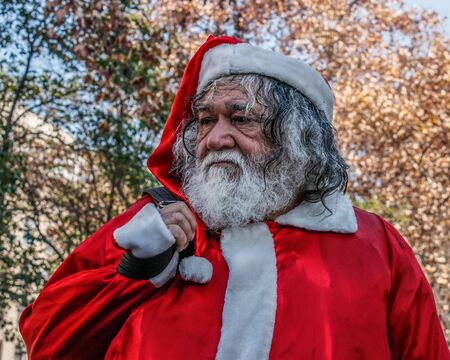 SANTIAGO, CHILE - 11 JUNE 2011: A demonstrator dressed as Santa Claus during clashes with students.のeditorial素材