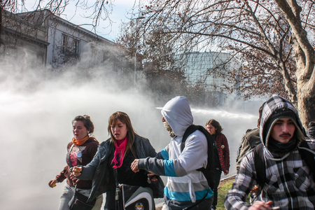 Santiago, Chile - July 14, 2011: Student's March, police used water cannon against the student protesters in Chile.のeditorial素材