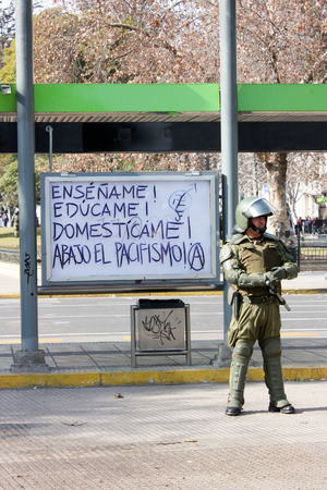 Santiago, Chile July 14, 2011: Police stand guard during a violent protest in Santiago, Chile.のeditorial素材