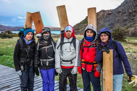 Torres del Paine, Chile - May 13, 2012: After the fire in the Torres del Paine National Park a group of happy voluntary workers at the areaのeditorial素材