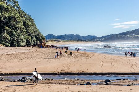 Whitianga, New Zealand - June 04, 2017:  People enjoying the sunny day at Hot Water beach, geothermal attractions in Coromandel, New Zealand.のeditorial素材