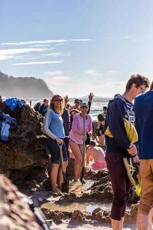 Coromandel Peninsula, New Zealand - June 04, 2017: Geothermal attractions in New Zealand, tourists making small hot water pools in Hot Water beach.のeditorial素材
