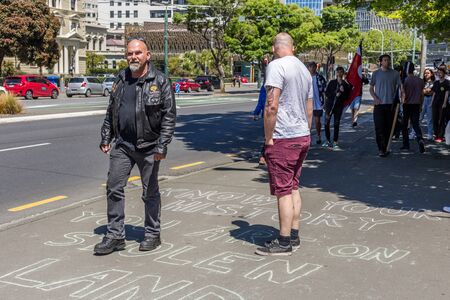 Wellington, New Zealand - October 28, 2017: National Front members made their way to Parliament against Protesters at New Zealand Parliament Building for inclusion and diversity hosted by Migrant & Refugee Rights Campaign.のeditorial素材