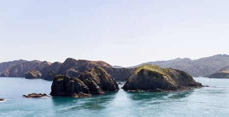 Wild landscape, shot from the top deck of a ferry, travelling from Wellington to Picton, New Zealand.の写真素材