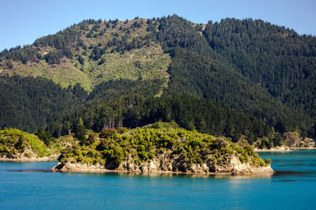 Wild landscape, shot from the top deck of a ferry, travelling from Wellington to Picton, New Zealand.の写真素材