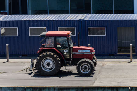 Wellington, New Zealand - December 23, 2017: Tractor moving to Bluebridge ferry anchored in...