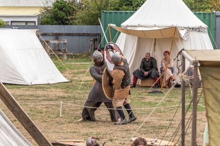 Levin, New Zealand - February 10, 2018: Reenactors battle in authentic armour at a medieval market...