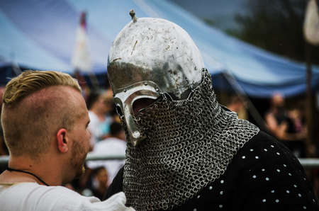 Levin, New Zealand - February 10, 2018: Reenactors battle in authentic armour at a medieval market...