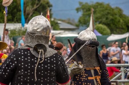 Levin, New Zealand - February 10, 2018: Reenactors battle in authentic armour at a medieval market in Levin showgrounds, New Zealand.のeditorial素材