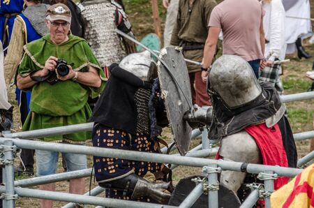 Levin, New Zealand - February 10, 2018: Reenactors battle in authentic armour at a medieval market in Levin showgrounds, New Zealand.のeditorial素材