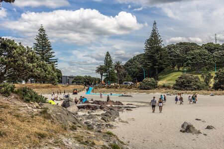 Mount Maunganui, New Zealand - December 31, 2017: Tourists enjoying the beach in Mount Maunganui, New Zealand.のeditorial素材
