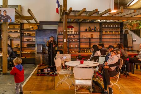 Auckland, New Zealand - June 10, 2018: Musician performs for patrons at the La Cigale French Market in Auckland, New Zealand.のeditorial素材