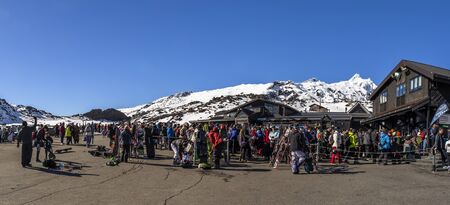Whakapapa, New Zealand - August 11, 2018: Skiiers line up for chairlift tickets on a busy Saturday at Whakapapa Ski Field, New Zealand.のeditorial素材