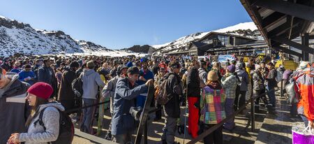 Whakapapa, New Zealand - August 11, 2018: Skiiers line up for chairlift tickets on a busy Saturday at Whakapapa Ski Field, New Zealand.のeditorial素材